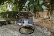 Direct Wicker Bobi Beige Wicker Double Seat Patio Swing Chair with Gray Cushion